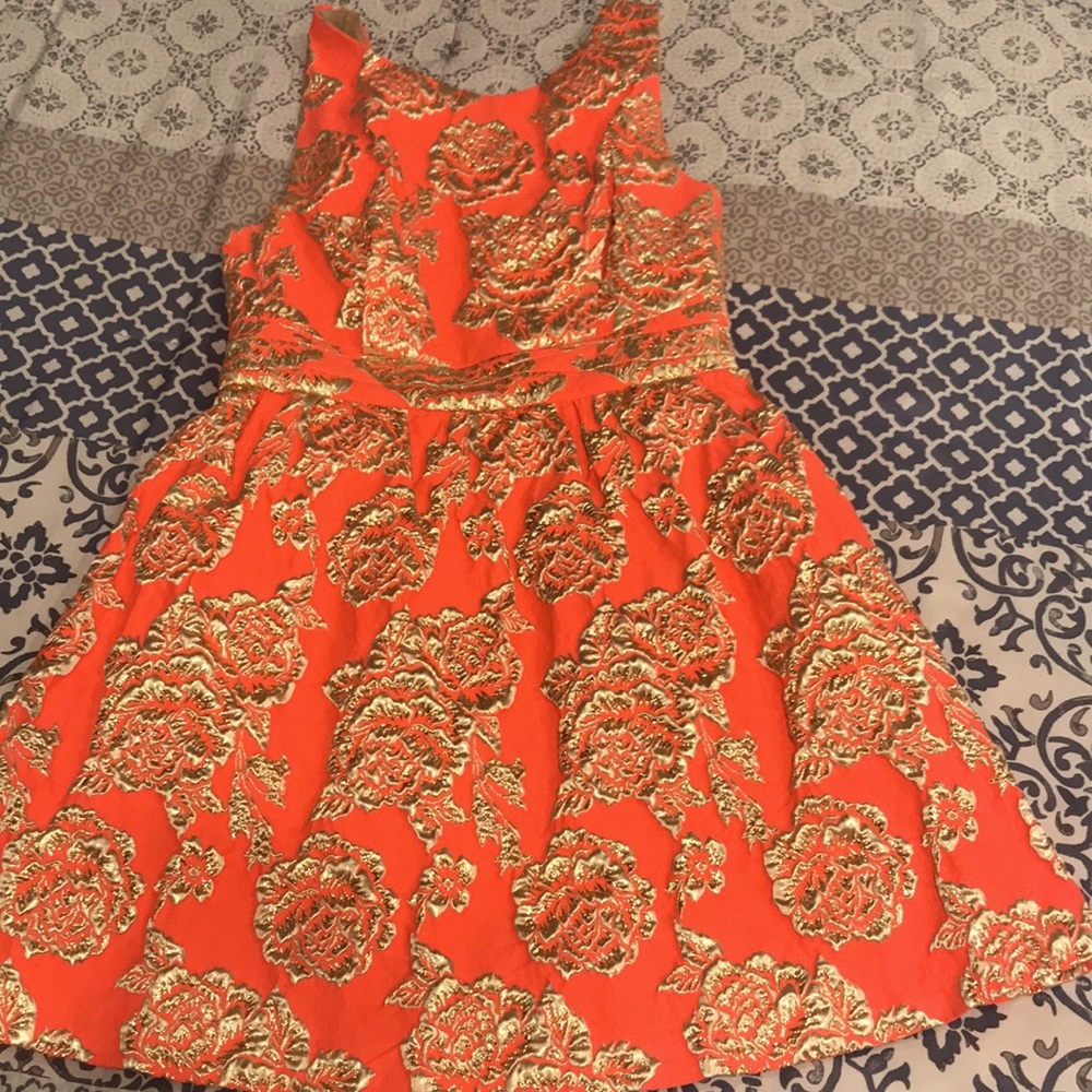 Women’s cocktail dress with gold embellishments